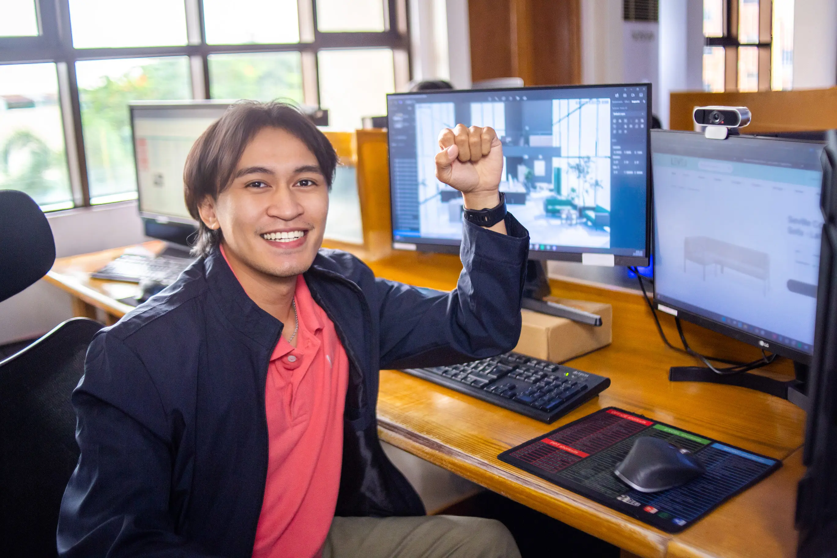 Professional Filipino BPO worker smiling at desk