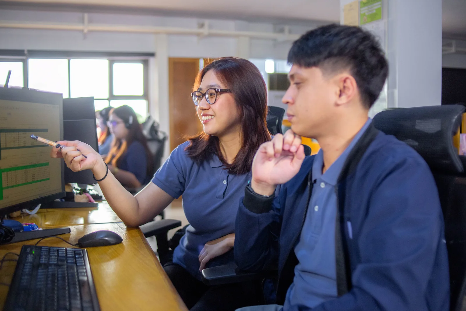 Yoonet team members collaborating in an office workspace