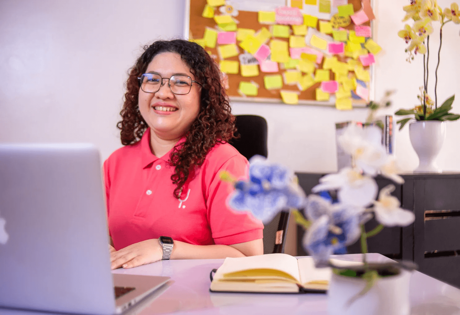 Professional Filipino BPO worker smiling at desk